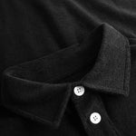 Collar on black shirt with white buttons