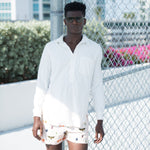 Model wearing off white long sleeve shirt