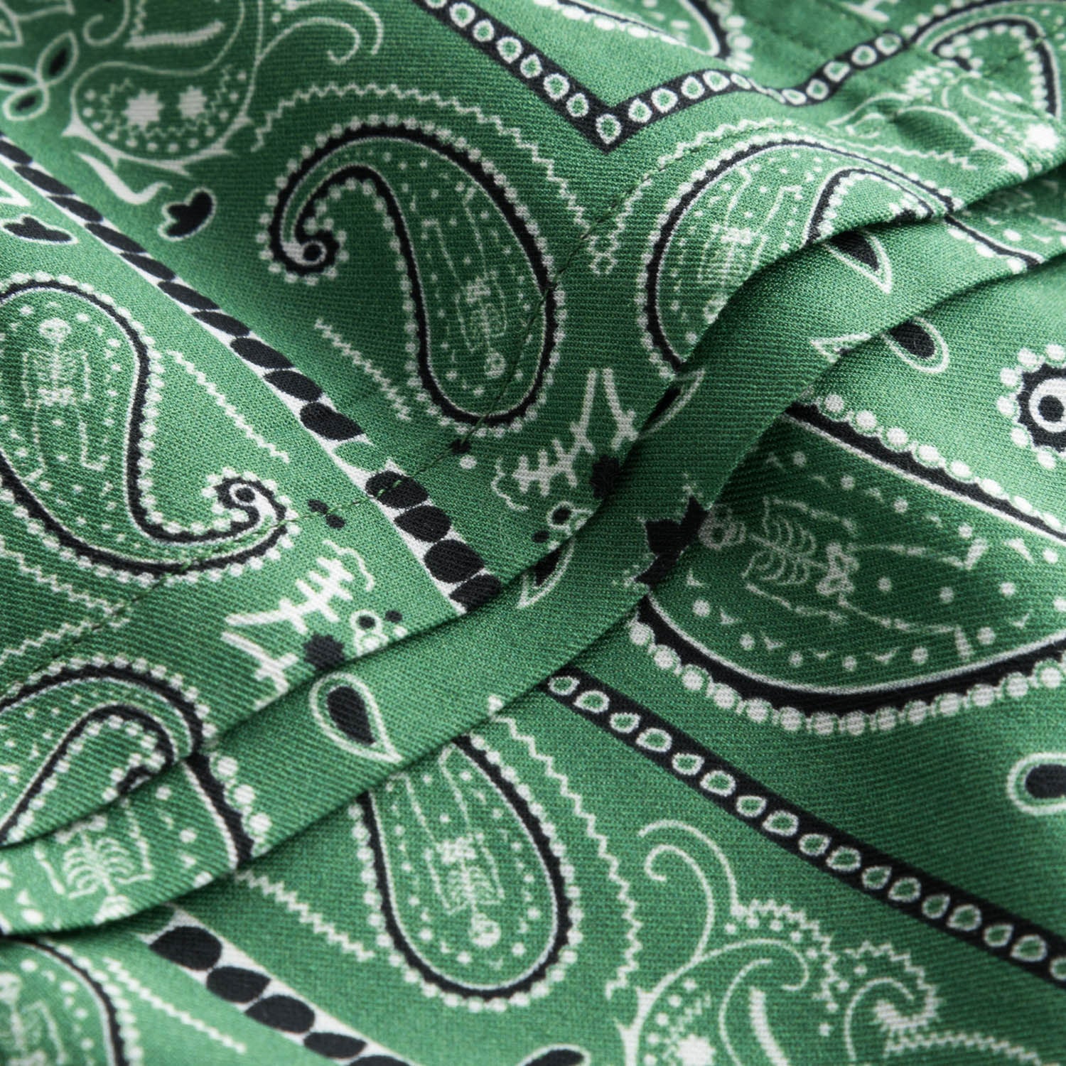 Close up on green vacation shirt