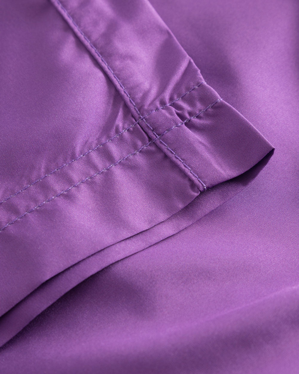 Close up of purple swim trunks