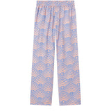 A pair of multicolor geometric patterned pants laid out flat against a white background.