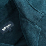Close up of open collar and tag on a navy blue short sleeve shirt