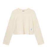 Off-white waffle-patterned cropped sweatshirt with a stitched-on material label.