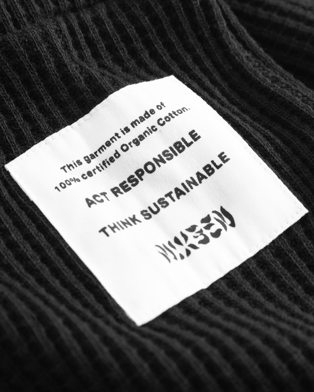 White patch with text on black fabrics
